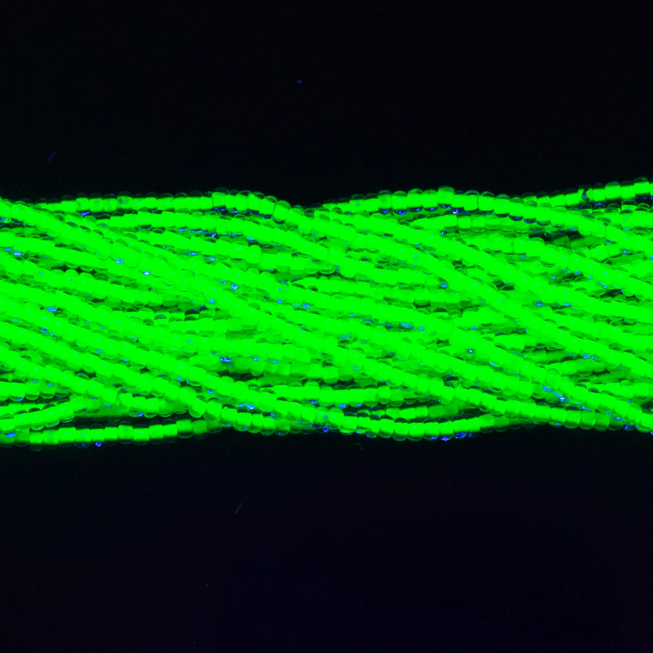 10SB784-N: Czech Seed Bead Neon Lined Green 10/0 Uv Reactive - 5 Hanks - Image 2