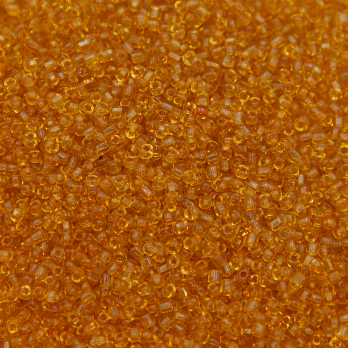 12SV253-5R: Vin Venetian Seed Bead Trans Gold #5 SQ-HOLE 12/0-50GMs - Image 2