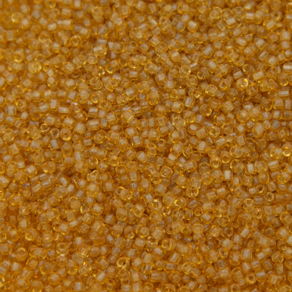 12SV253-7R: Vin Venetian Seed Bead Trans Gold #7 SQ-HOLE 12/0-50GMs - Image 2