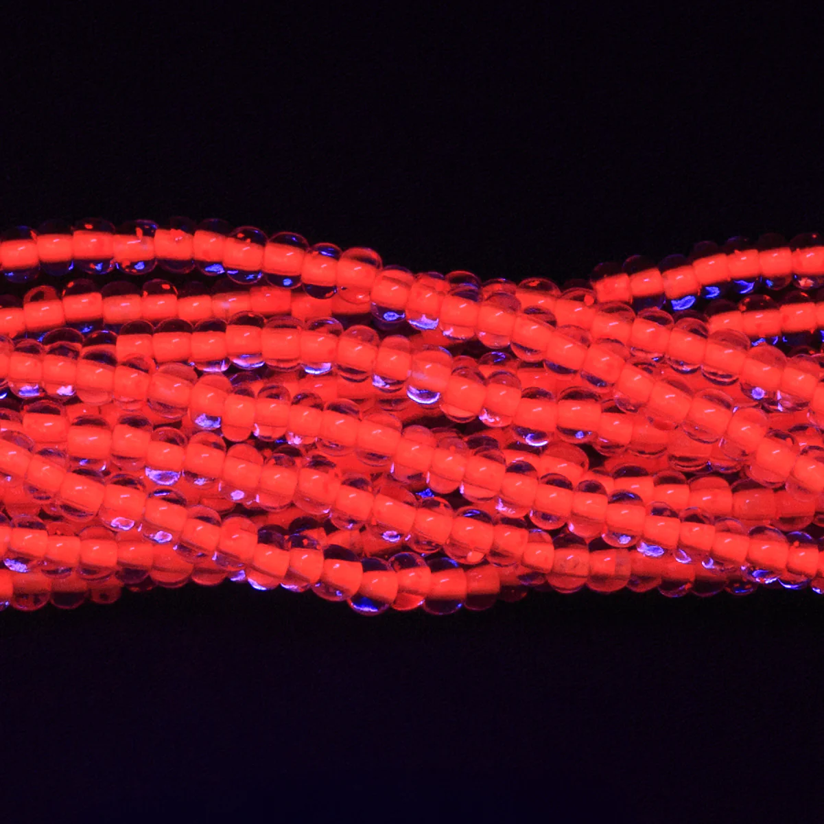 6SB734-N: CZ Seed Bead Neon Lined Orange 6/0 Uv Reactive 36STR - Image 2